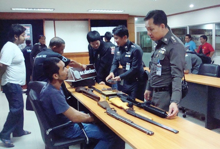 Police have arrested alleged gun repairman Surachit Wirojwong and confiscated a cache of weapons, but so far no charges have been filed.
